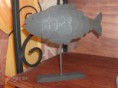 peixe com vela para projectar luz